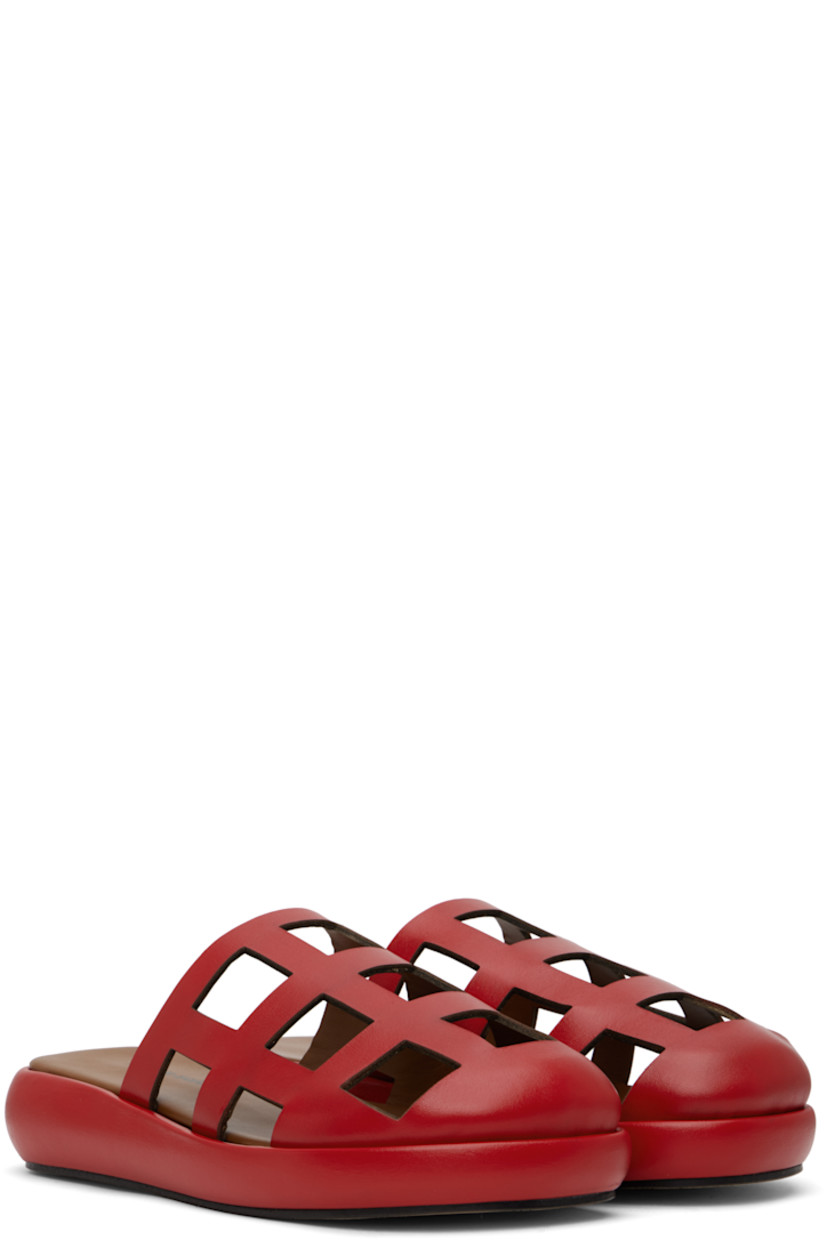 Handcrafted buffed leather slippers in red.

· Cutouts throughout
· Logo printed at padded leather footbed
· Grained leather lining
· Covered midsole
· Suede sole

Supplier color: Red