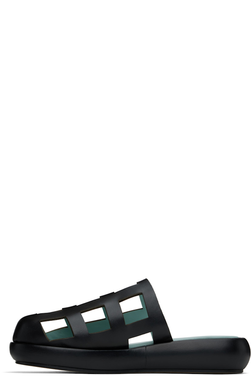 Buffed leather slippers in black.

· Cutouts throughout
· Logo printed at padded footbed
· Covered midsole 
· Suede sole

Supplier color: Black