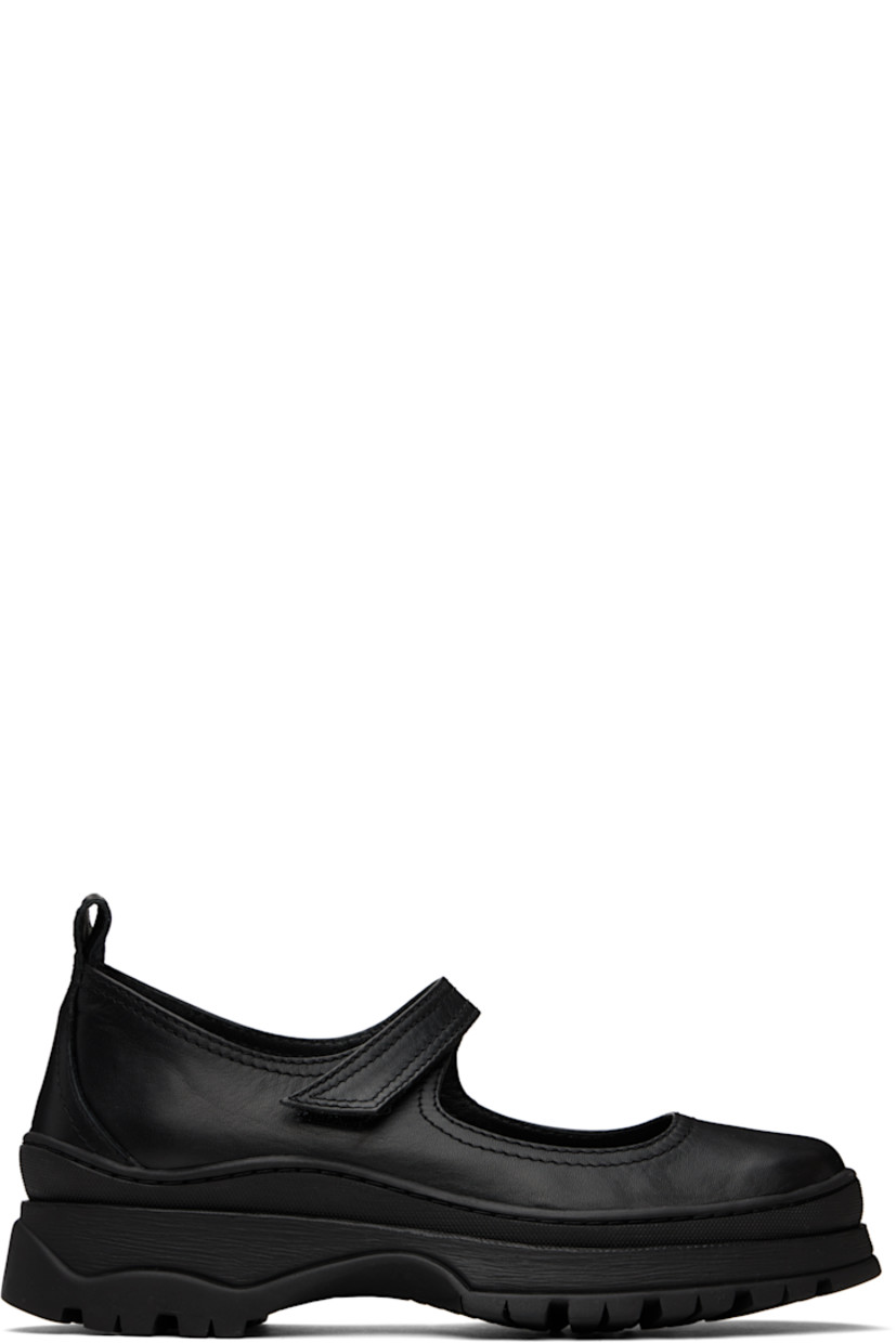 Handcrafted low-top buffed leather Mary Jane-style sneakers in black.

· Velcro strap at vamp
· Pull-loop at heel tab
· Grained leather and suede lining
· Textured rubber platform midsole
· Treaded rubber sole
· Platform: H2"

Supplier color: Black