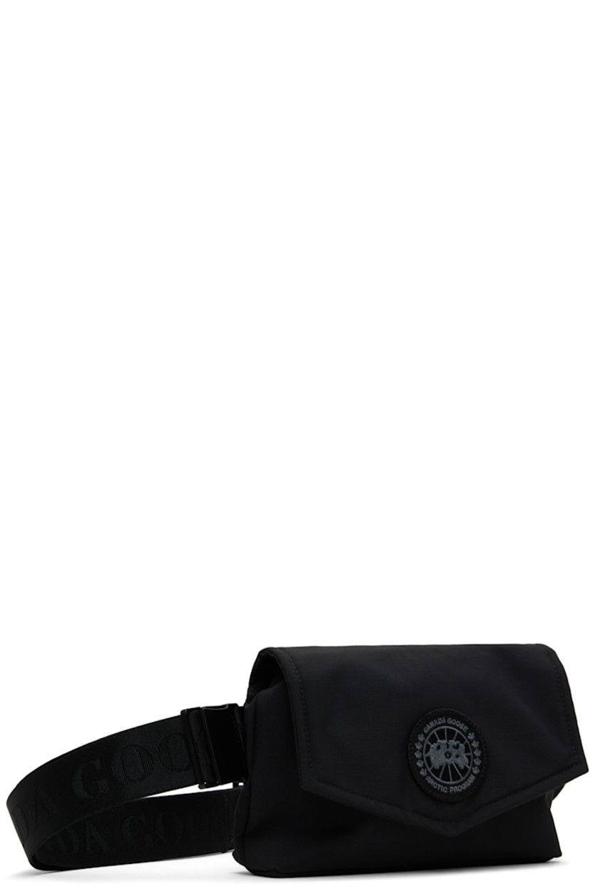 Insulated CORDURA® nylon duck canvas belt bag in black.

· Water-repellent and durable
· Adjustable logo-woven crossbody strap
· Embroidered logo patch at face
· Press-stud flap
· Zip closure
· Patch pocket at interior
· Quilted taffeta lining
· H5.5" x W8.5" x D1.75"

Supplier color: Black