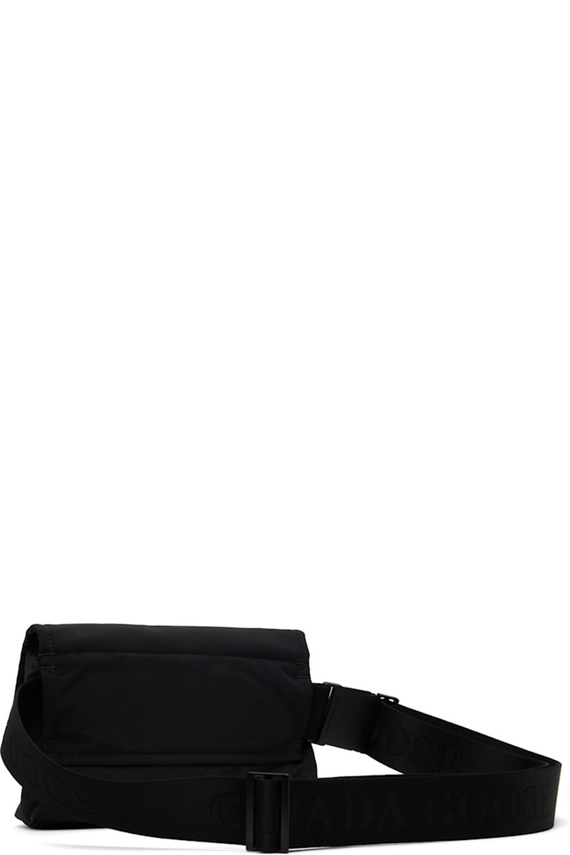 Insulated CORDURA® nylon duck canvas belt bag in black.

· Water-repellent and durable
· Adjustable logo-woven crossbody strap
· Embroidered logo patch at face
· Press-stud flap
· Zip closure
· Patch pocket at interior
· Quilted taffeta lining
· H5.5" x W8.5" x D1.75"

Supplier color: Black