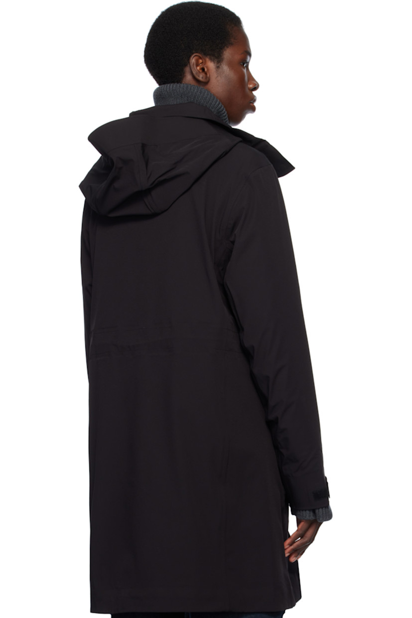 Stretch nylon taffeta rain coat. Lightweight and waterproof.

· Concealed bungee-style drawstring at brimmed hood
· Two-way zip closure with press-stud placket
· Bungee-style drawstring at waist
· Flap pockets
· Rubberized logo patch at sleeve
· Velcro tab at cuffs
· Taped seams at interior
· Full bonded jersey lining

Supplier color: Black