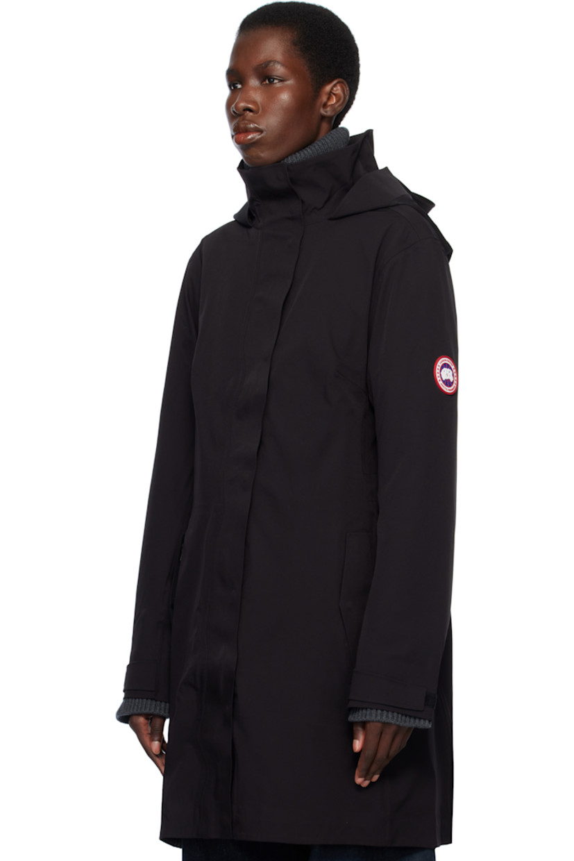 Stretch nylon taffeta rain coat. Lightweight and waterproof.

· Concealed bungee-style drawstring at brimmed hood
· Two-way zip closure with press-stud placket
· Bungee-style drawstring at waist
· Flap pockets
· Rubberized logo patch at sleeve
· Velcro tab at cuffs
· Taped seams at interior
· Full bonded jersey lining

Supplier color: Black
