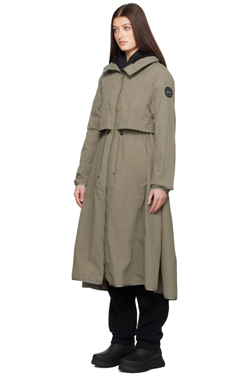 AcclimaLuxe nylon taffeta jacket. Lightweight, wind-resistant, and water-repellent.

· Concealed bungee-style drawstring at stowaway hood
· Two-way zip closure
· Storm flap at front and back
· Zip pockets
· Bungee-style drawstring at waist
· Elasticized trim at hem and cuffs
· Embroidered logo patch at sleeve
· Locker loop at back collar
· Patch pockets at interior
· Partial mesh lining

Part of the Black Label collection.

Supplier color: Smokey sage