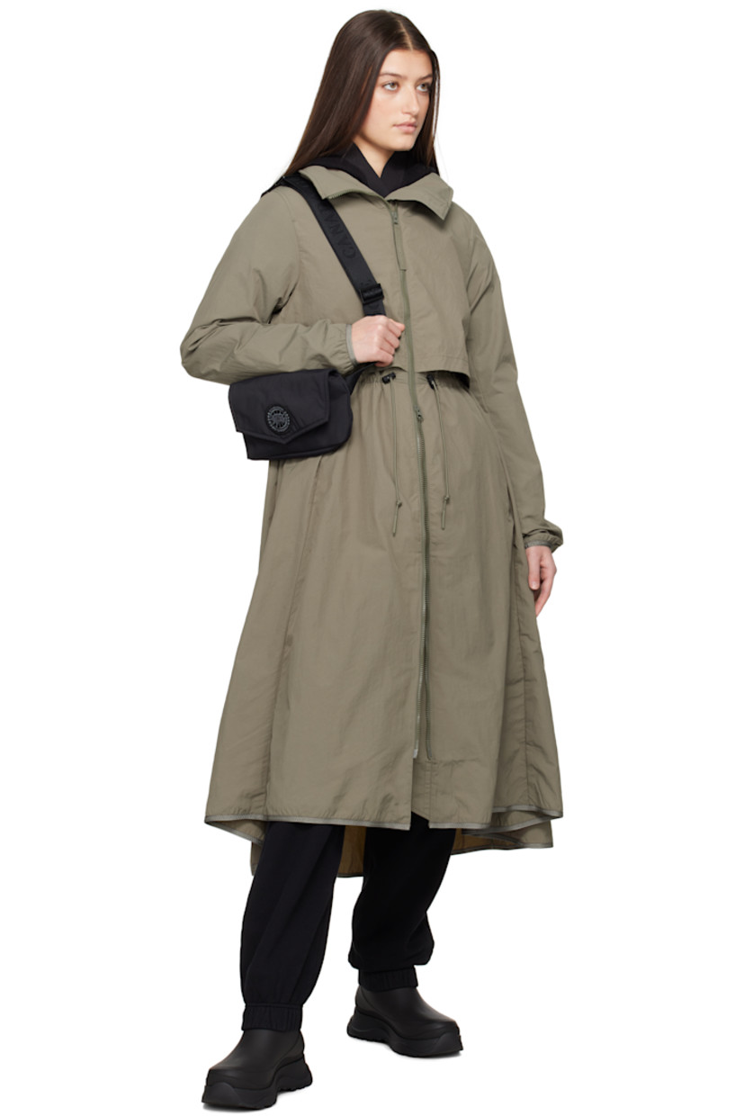 AcclimaLuxe nylon taffeta jacket. Lightweight, wind-resistant, and water-repellent.

· Concealed bungee-style drawstring at stowaway hood
· Two-way zip closure
· Storm flap at front and back
· Zip pockets
· Bungee-style drawstring at waist
· Elasticized trim at hem and cuffs
· Embroidered logo patch at sleeve
· Locker loop at back collar
· Patch pockets at interior
· Partial mesh lining

Part of the Black Label collection.

Supplier color: Smokey sage
