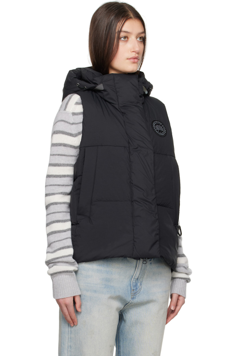 Down-filled and quilted nylon taffeta vest.

· Bungee-style drawstring at detachable hood
· Stand collar
· Two-way zip closure with press-stud placket
· Embroidered logo patch at chest
· Zip pockets
· Bungee-style drawstring at hem
· Patch pocket at interior
· Full satin lining

Part of the Black Label collection.

Supplier color: Black

Fill: 90% duck down, 10% duck feather.