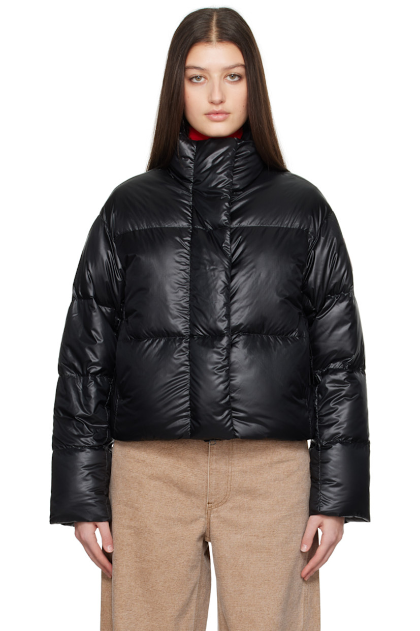 Down-filled and quilted recycled nylon ripstop jacket. Packable, lightweight, water-repellent, and wind-resistant.

· Stand collar
· Two-way zip closure with button placket
· Seam pockets
· Bungee-style drawstring at cropped hem
· Dropped shoulders
· Embroidered logo patch at sleeve
· Inset rib-knit cuffs
· Detachable logo-woven shoulder straps at interior
· Welt and zip pocket at interior
· Mesh patch pockets at interior
· Full satin lining

Supplier color: Black

 Fill: 90% duck down, 10% down feather.