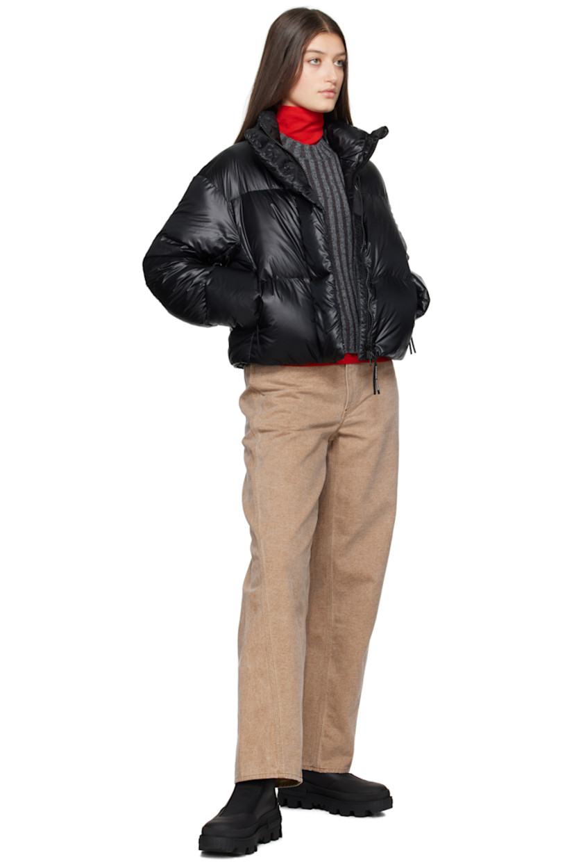 Down-filled and quilted recycled nylon ripstop jacket. Packable, lightweight, water-repellent, and wind-resistant.

· Stand collar
· Two-way zip closure with button placket
· Seam pockets
· Bungee-style drawstring at cropped hem
· Dropped shoulders
· Embroidered logo patch at sleeve
· Inset rib-knit cuffs
· Detachable logo-woven shoulder straps at interior
· Welt and zip pocket at interior
· Mesh patch pockets at interior
· Full satin lining

Supplier color: Black

 Fill: 90% duck down, 10% down feather.