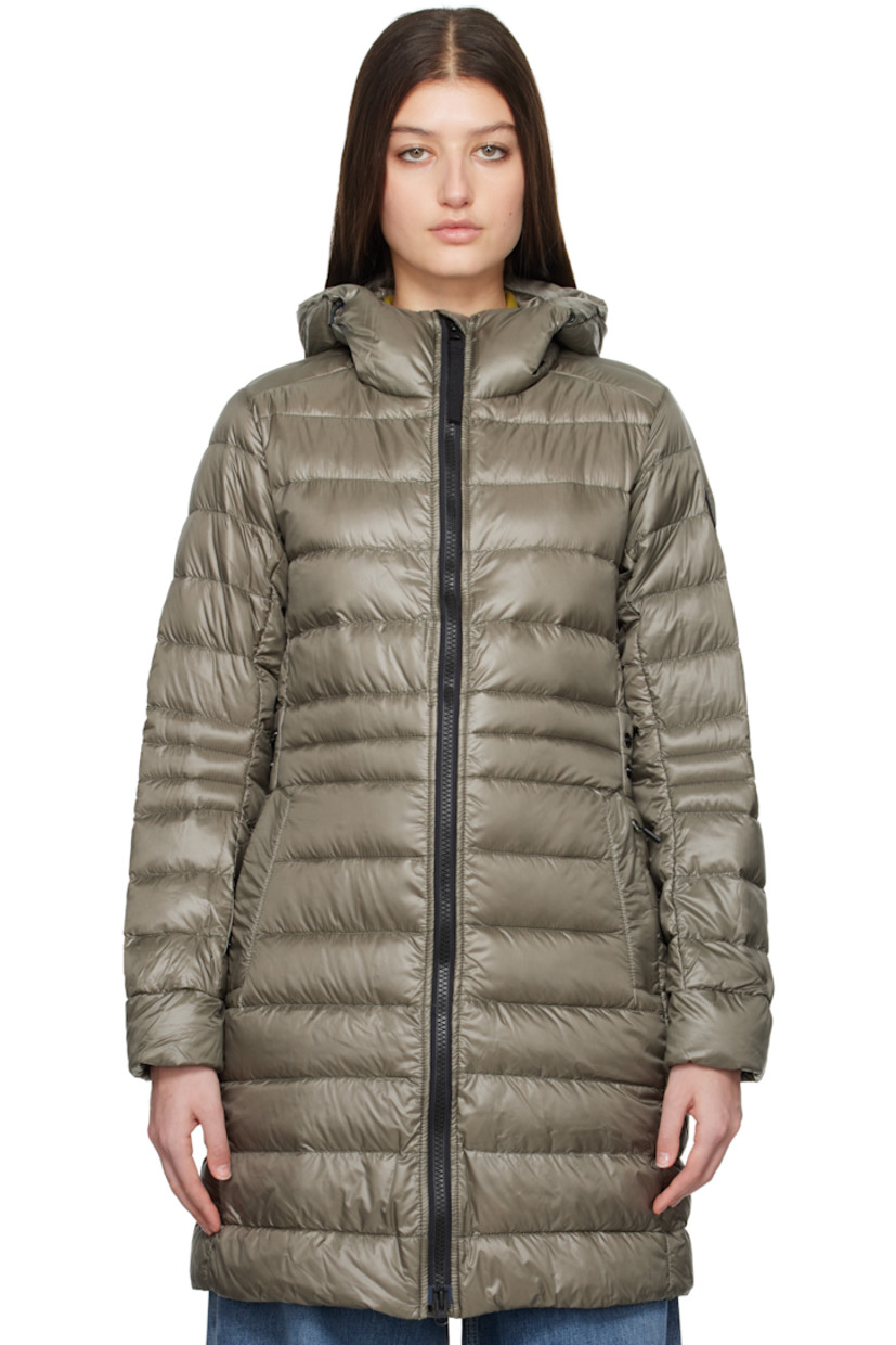 Down-filled and quilted recycled nylon ripstop jacket. Packable, lightweight, water-repellent, and wind-resistant.

· Bungee-style drawstring at hood
· Two-way zip closure
· Zip pockets
· Logo patch at sleeve
· Inset Power Stretch® jersey cuffs
· Reflective trim at back collar
· Integrated adjustable press-stud strap at back waist
· Press-stud vents at back hem
· Patch pockets at interior
· Detachable elasticized shoulder straps at interior
· Fully lined

Part of the Black Label collection.
 
Supplier color: Smokey sage

Fill: 90% duck down, 10% duck feather.