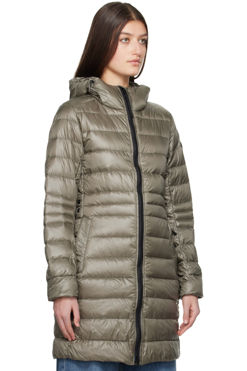Down-filled and quilted recycled nylon ripstop jacket. Packable, lightweight, water-repellent, and wind-resistant.

· Bungee-style drawstring at hood
· Two-way zip closure
· Zip pockets
· Logo patch at sleeve
· Inset Power Stretch® jersey cuffs
· Reflective trim at back collar
· Integrated adjustable press-stud strap at back waist
· Press-stud vents at back hem
· Patch pockets at interior
· Detachable elasticized shoulder straps at interior
· Fully lined

Part of the Black Label collection.
 
Supplier color: Smokey sage

Fill: 90% duck down, 10% duck feather.