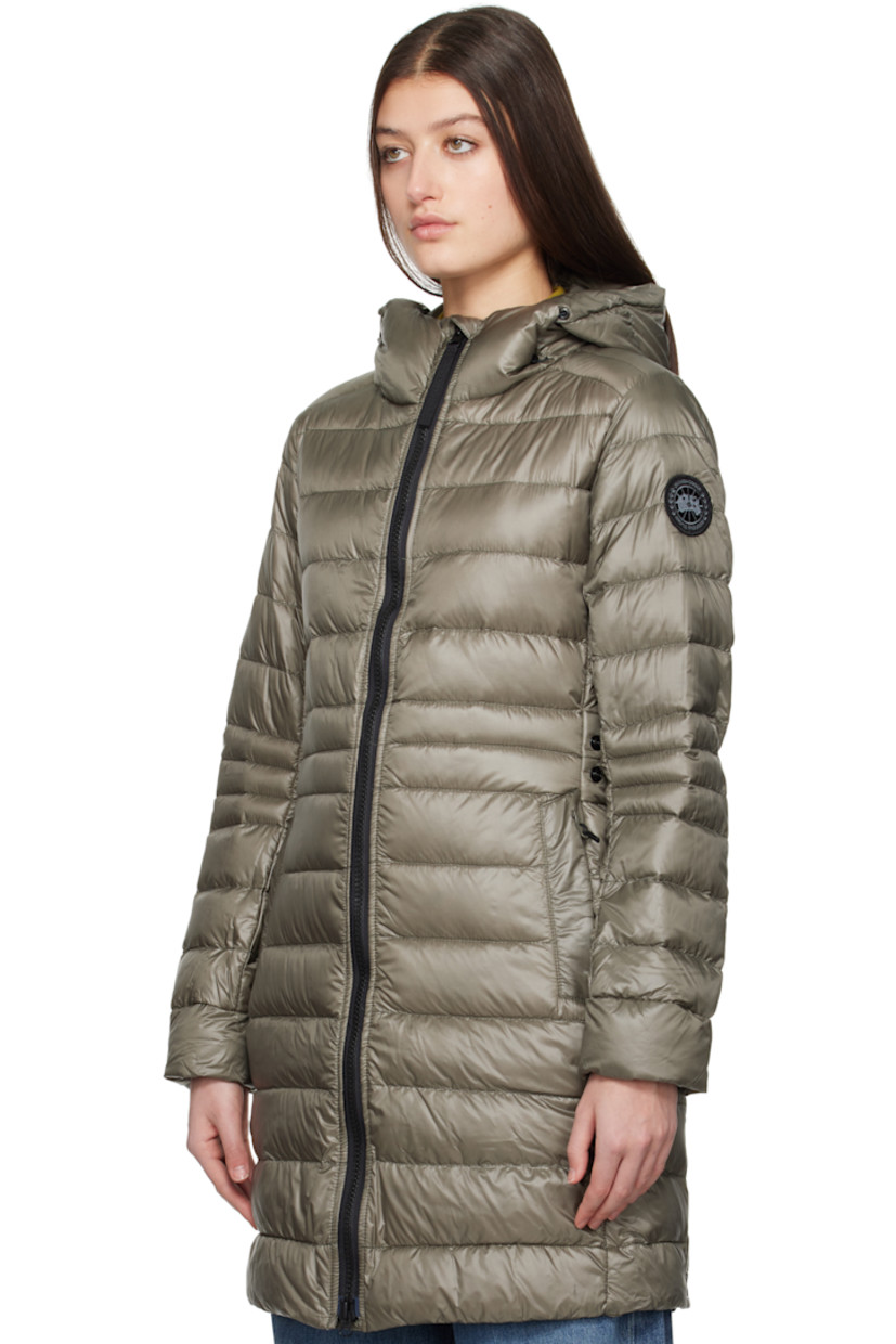 Down-filled and quilted recycled nylon ripstop jacket. Packable, lightweight, water-repellent, and wind-resistant.

· Bungee-style drawstring at hood
· Two-way zip closure
· Zip pockets
· Logo patch at sleeve
· Inset Power Stretch® jersey cuffs
· Reflective trim at back collar
· Integrated adjustable press-stud strap at back waist
· Press-stud vents at back hem
· Patch pockets at interior
· Detachable elasticized shoulder straps at interior
· Fully lined

Part of the Black Label collection.
 
Supplier color: Smokey sage

Fill: 90% duck down, 10% duck feather.
