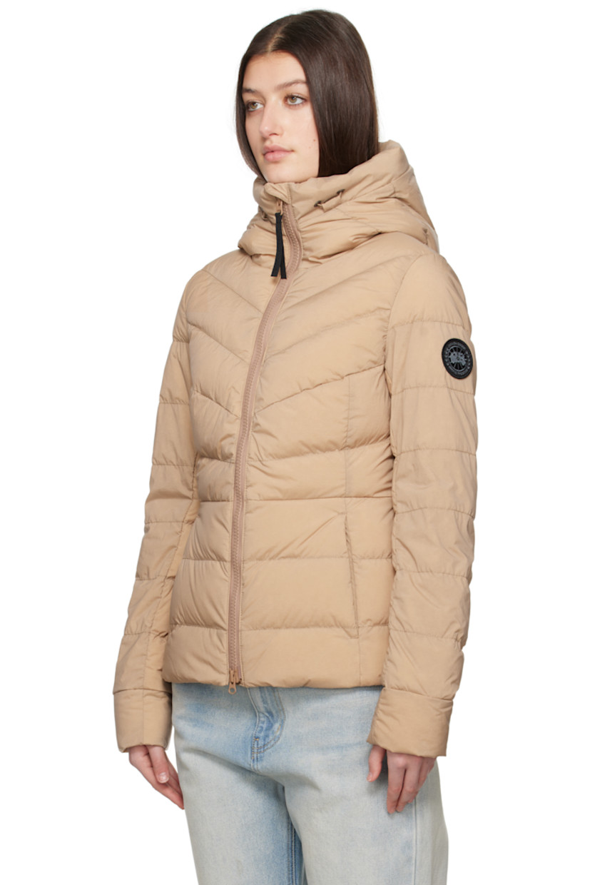 Down-filled and quilted stretch nylon taffeta jacket. Lightweight, wind-resistant, and water-repellent.

· Bungee-style drawstring at hood
· Funnel neck
· Two-way zip closure
· Zip pockets
· Embroidered logo patch at sleeve
· Logo-woven shoulder straps at interior
· Zip pocket at interior
· Fully lined

Part of the Black Label collection.

Supplier color: Desert sand

Fill: 90% duck down, 10% duck feather.