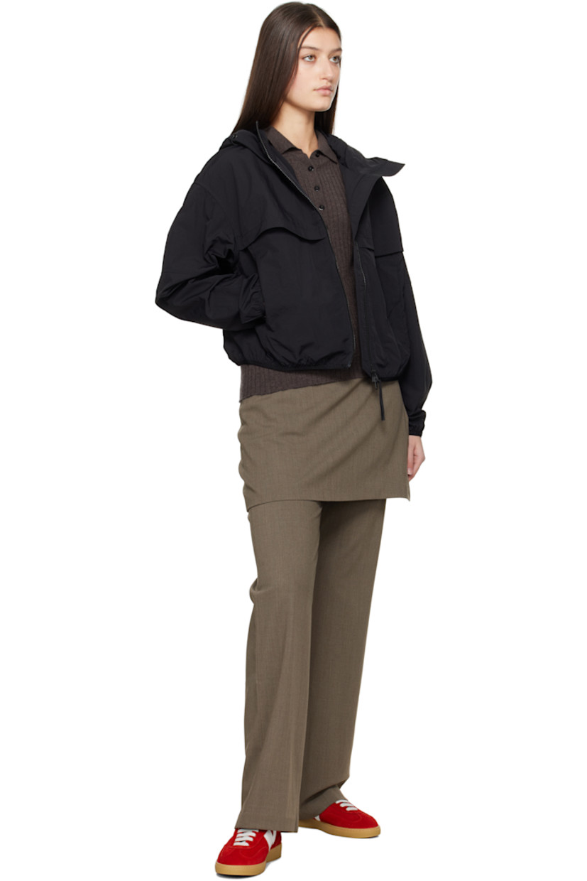 AcclimaLuxe nylon taffeta jacket. Lightweight, durable, water-repellent and wind-resistant.

· Elasticized trim at hood, cropped hem, and cuffs
· Bungee-style drawstring at hood
· Two-way zip closure
· Storm flaps at front and back
· Zip pockets
· Embroidered logo patch at sleeve
· Locker loop at back collar
· Patch pocket at interior
· Partial mesh lining

Part of the Black Label collection.

Supplier color: Black