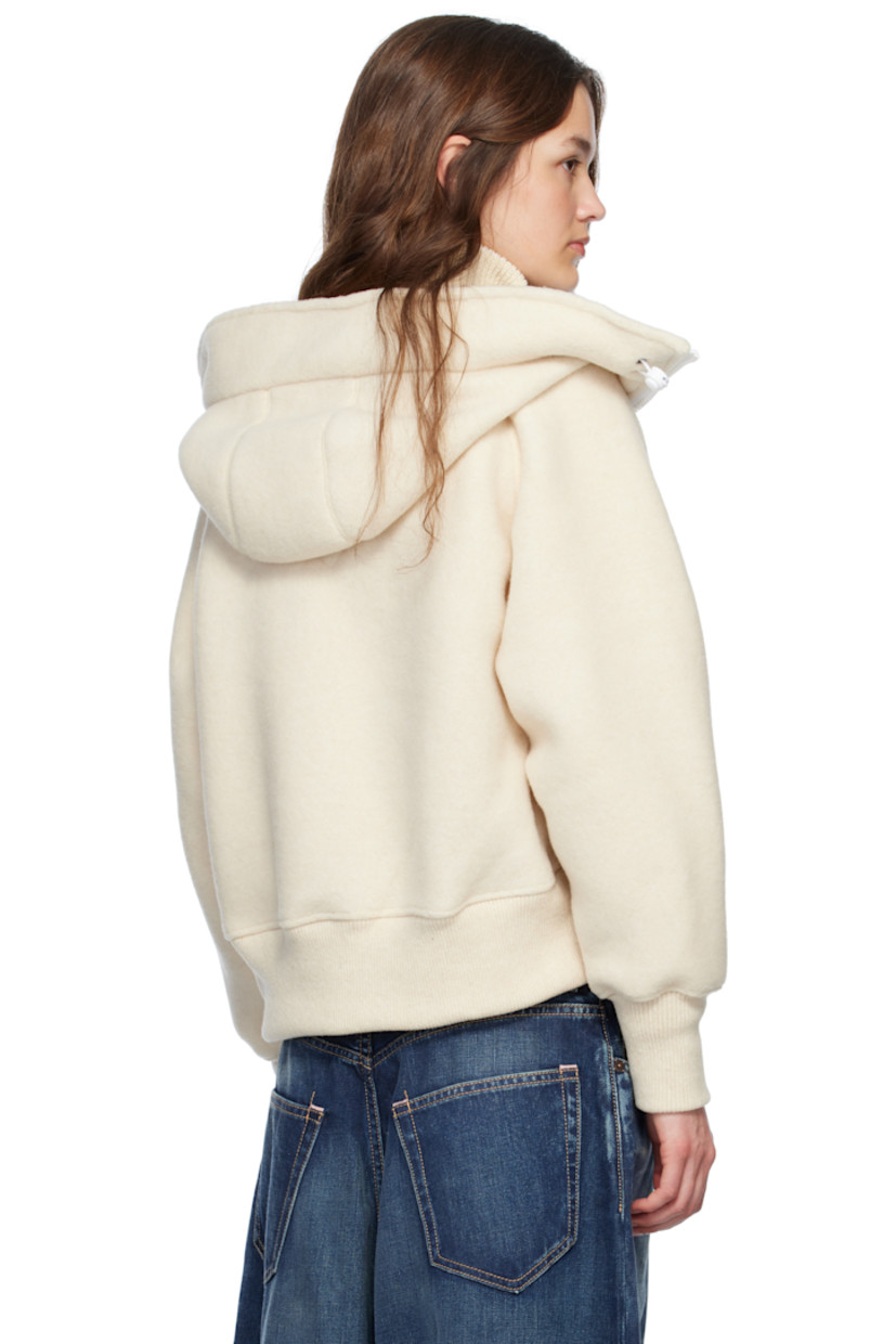 Recycled wool- and TENCEL™ lyocell-blend fleece jacket. 

· Bungee-style drawstring at hood
· Stand collar at hood
· Zip closure
· Welt pockets
· Rib-knit hem and cuffs
· Embroidered logo patch at sleeve
· Topstitching at back
· Unlined

Part of the HUMANATURE capsule collection.

Supplier color: Linen