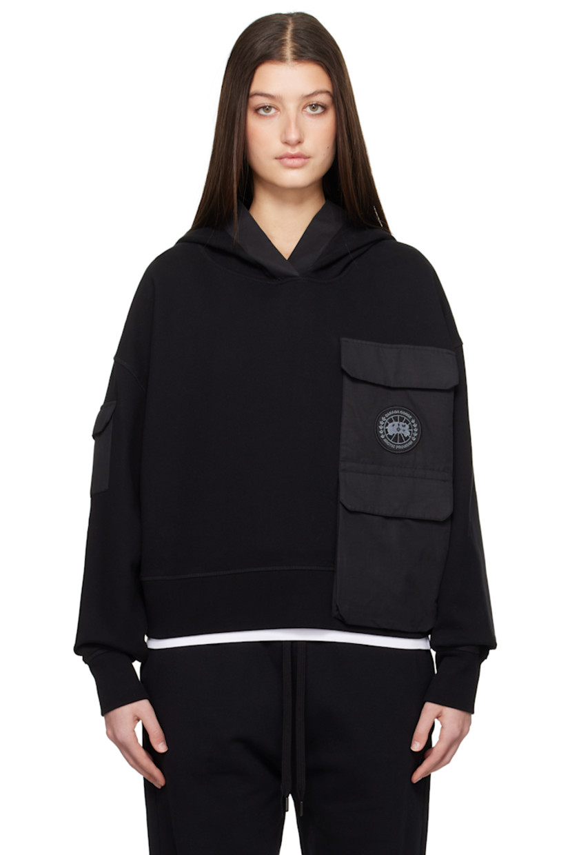 Cotton fleece hoodie. Plain-woven cotton-blend panels throughout.

· Patch pockets and zip pocket
· Embroidered logo patch at chest
· Rib-knit hem and cuffs
· Flap pocket at sleeve

Supplier color: Black