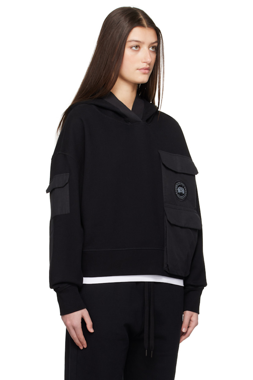 Cotton fleece hoodie. Plain-woven cotton-blend panels throughout.

· Patch pockets and zip pocket
· Embroidered logo patch at chest
· Rib-knit hem and cuffs
· Flap pocket at sleeve

Supplier color: Black
