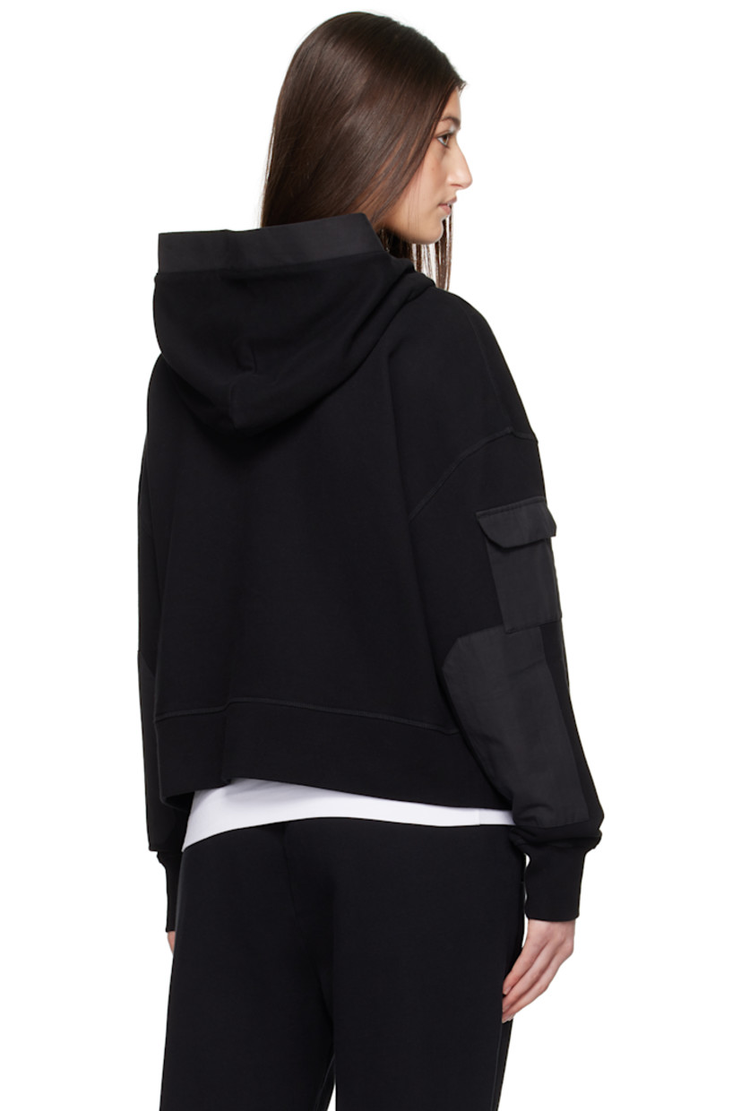 Cotton fleece hoodie. Plain-woven cotton-blend panels throughout.

· Patch pockets and zip pocket
· Embroidered logo patch at chest
· Rib-knit hem and cuffs
· Flap pocket at sleeve

Supplier color: Black