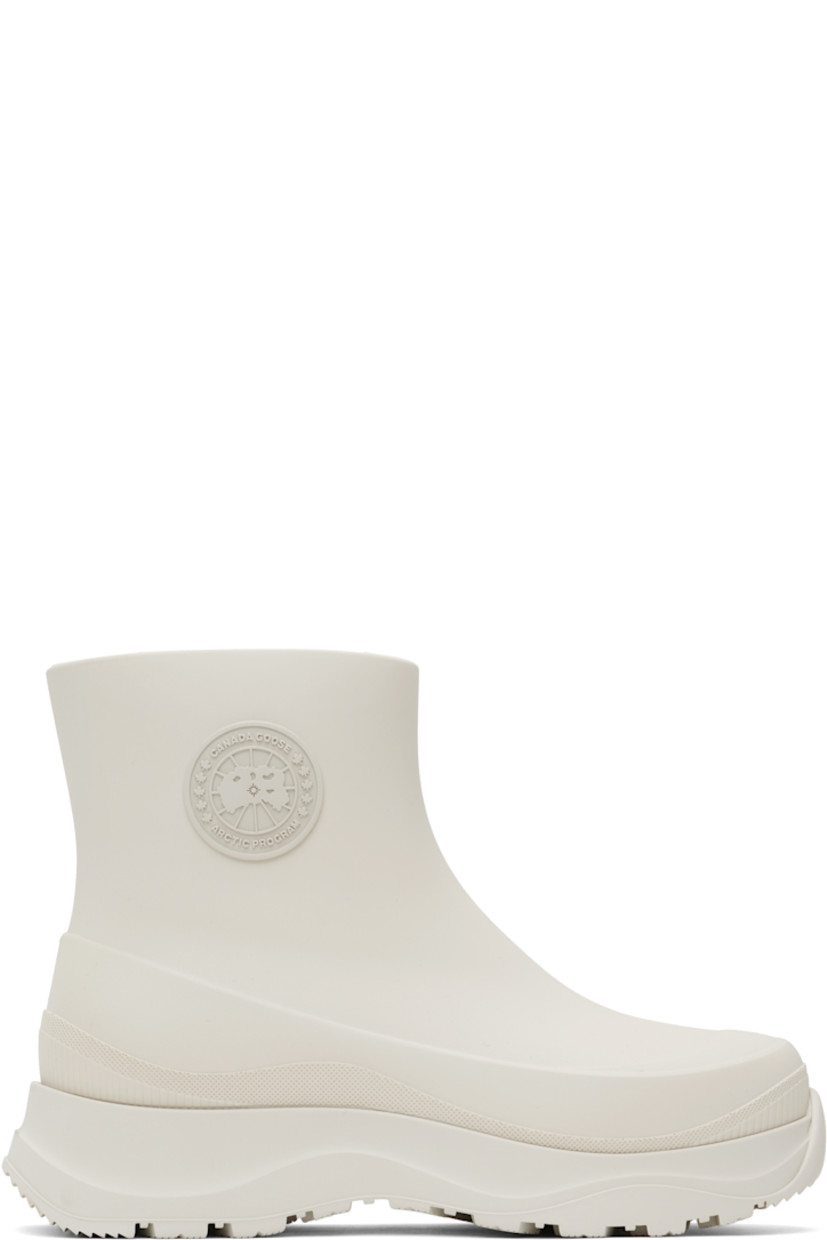 Ankle-high lightweight rubber boots in off-white.

· Waterproof 
· Logo patch at outer side
· Removable shearling insole
· Moisture-wicking footbed 
· Treaded rubber sole

Supplier color: Snowcap