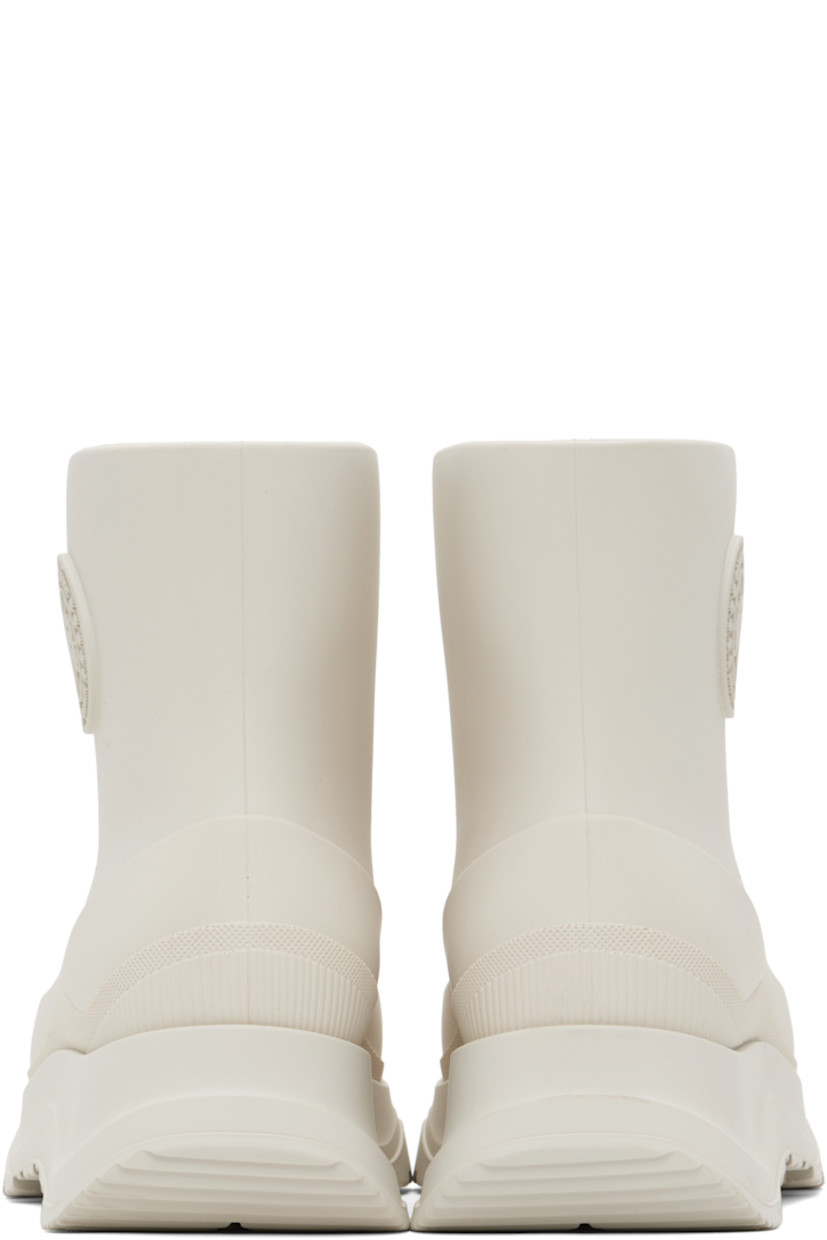 Ankle-high lightweight rubber boots in off-white.

· Waterproof 
· Logo patch at outer side
· Removable shearling insole
· Moisture-wicking footbed 
· Treaded rubber sole

Supplier color: Snowcap