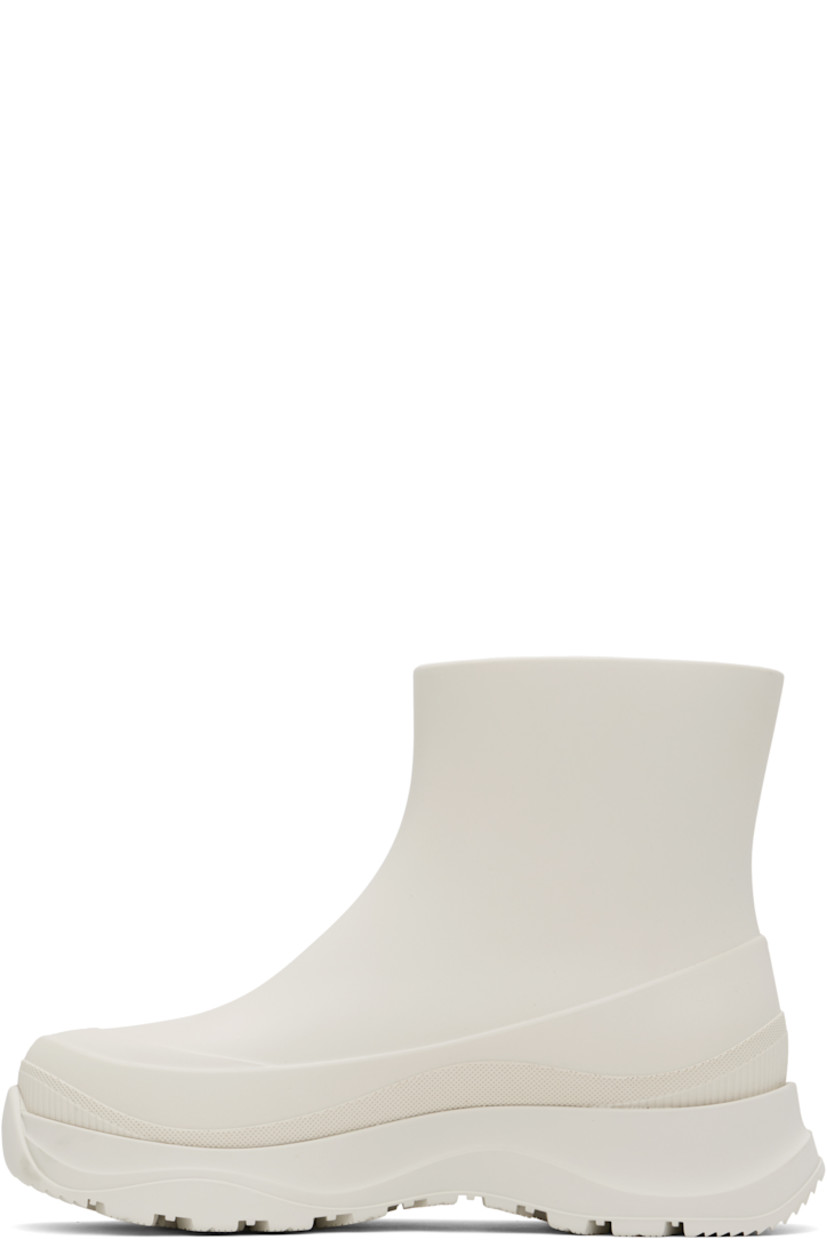 Ankle-high lightweight rubber boots in off-white.

· Waterproof 
· Logo patch at outer side
· Removable shearling insole
· Moisture-wicking footbed 
· Treaded rubber sole

Supplier color: Snowcap