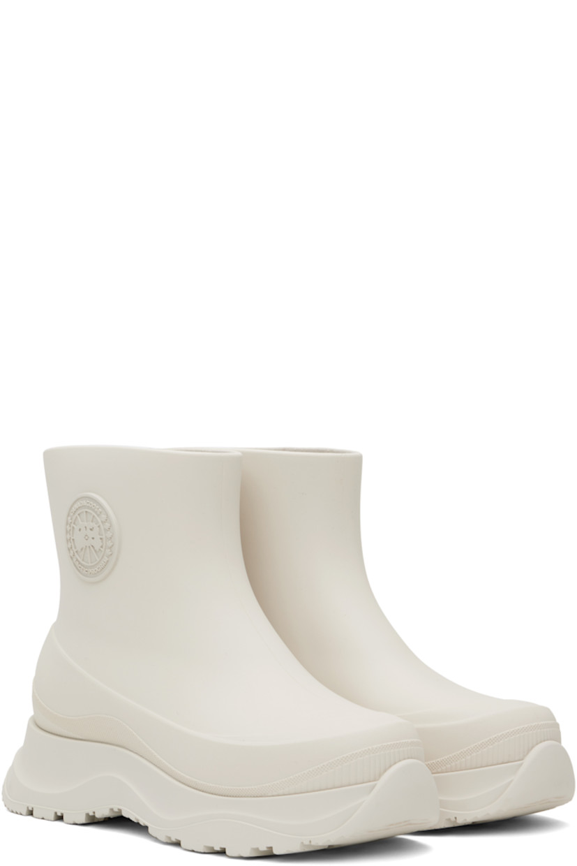 Ankle-high lightweight rubber boots in off-white.

· Waterproof 
· Logo patch at outer side
· Removable shearling insole
· Moisture-wicking footbed 
· Treaded rubber sole

Supplier color: Snowcap