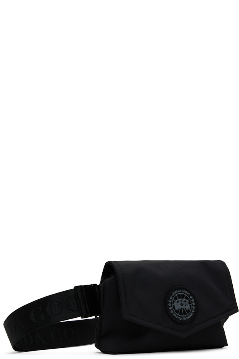 Insulated CORDURA® nylon duck canvas belt bag in black.

· Water-repellent and durable
· Adjustable logo-woven crossbody strap
· Embroidered logo patch at face
· Press-stud flap
· Zip closure
· Patch pocket at interior
· Quilted taffeta lining
· H5.5" x W8.5" x D1.75"

Supplier color: Black