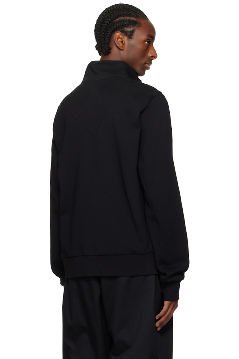 Down-filled and quilted nylon taffeta and French terry jacket. Lightweight.

· RDS-certified down
· Paneled construction
· Rib-knit stand collar, hem, and cuffs
· Logo-bonded zip-pull at zip closure
· Logo-woven trim at placket
· Zip pockets 
· Embroidered logo patch at sleeve
· Partial taffeta lining

Supplier color: Black

Fill: 90% duck down, 10% duck feather.
