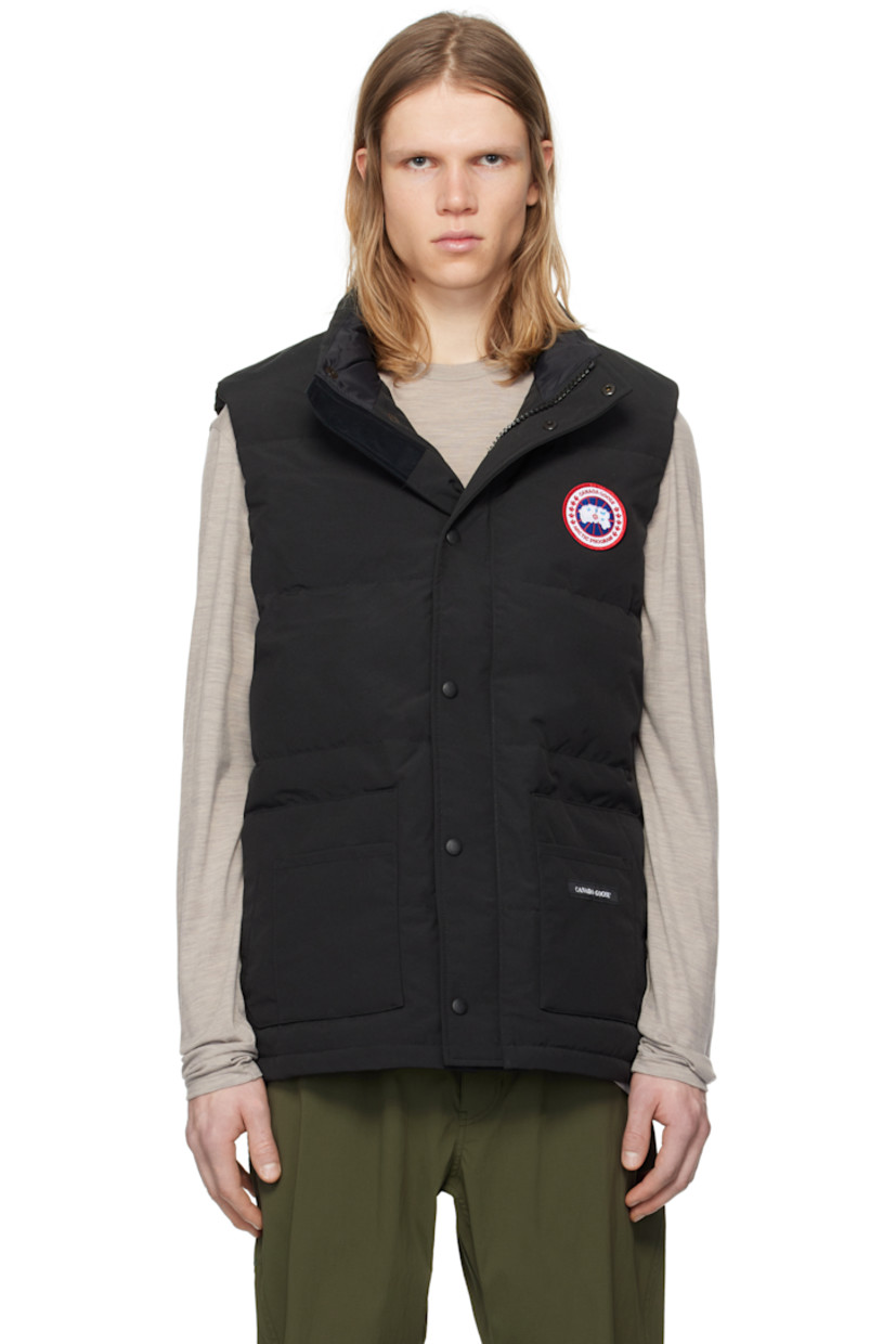 Down-filled quilted Arctic Tech® polyester- and cotton-blend canvas vest. Water-repellent.

· Stand collar
· Zip closure with press-stud placket
· Embroidered logo patch at chest
· Patch pockets and welt pockets
· Logo patch at front 
· Zip pocket at interior
· Full satin lining

Supplier color: Black

Fill: 80% duck down, 20% duck feather.