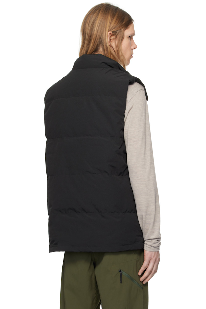 Down-filled quilted Arctic Tech® polyester- and cotton-blend canvas vest. Water-repellent.

· Stand collar
· Zip closure with press-stud placket
· Embroidered logo patch at chest
· Patch pockets and welt pockets
· Logo patch at front 
· Zip pocket at interior
· Full satin lining

Supplier color: Black

Fill: 80% duck down, 20% duck feather.