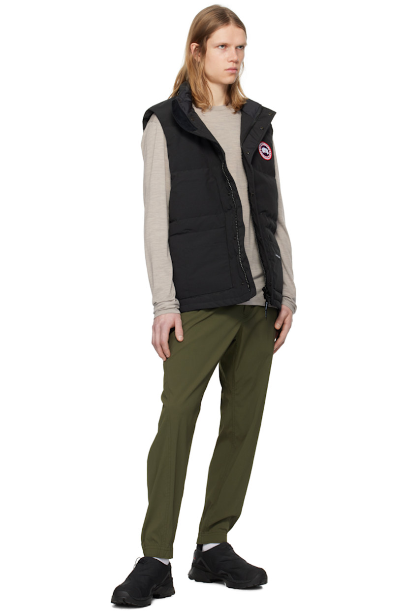 Down-filled quilted Arctic Tech® polyester- and cotton-blend canvas vest. Water-repellent.

· Stand collar
· Zip closure with press-stud placket
· Embroidered logo patch at chest
· Patch pockets and welt pockets
· Logo patch at front 
· Zip pocket at interior
· Full satin lining

Supplier color: Black

Fill: 80% duck down, 20% duck feather.