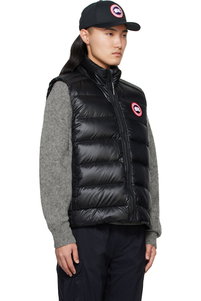 Packable quilted down-filled nylon taffeta ripstop down vest. Wind-resistant and water repellent.

· Funnel neck
· Two-way zip closure
· Logo patch at chest
· Zip pockets
· Patch pocket with bungee-style drawstring at interior
· Full nylon satin lining

Supplier color: Black

Fill: 90% down, 10% feathers.
