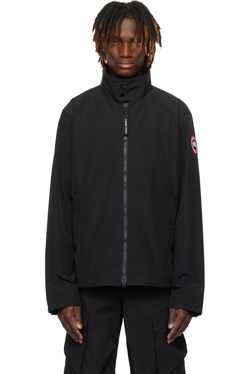 Polyester- and cotton-blend Arctic Tech® duck canvas jacket. Water-repellent.

· Press-stud fastening at stand collar
· Two-way zip closure
· Zip pockets
· Embroidered logo patch at sleeve
· Adjustable press-stud tab at cuffs
· Reflective trim at back collar
· Zip pocket at interior
· Full satin lining

Supplier color: Black