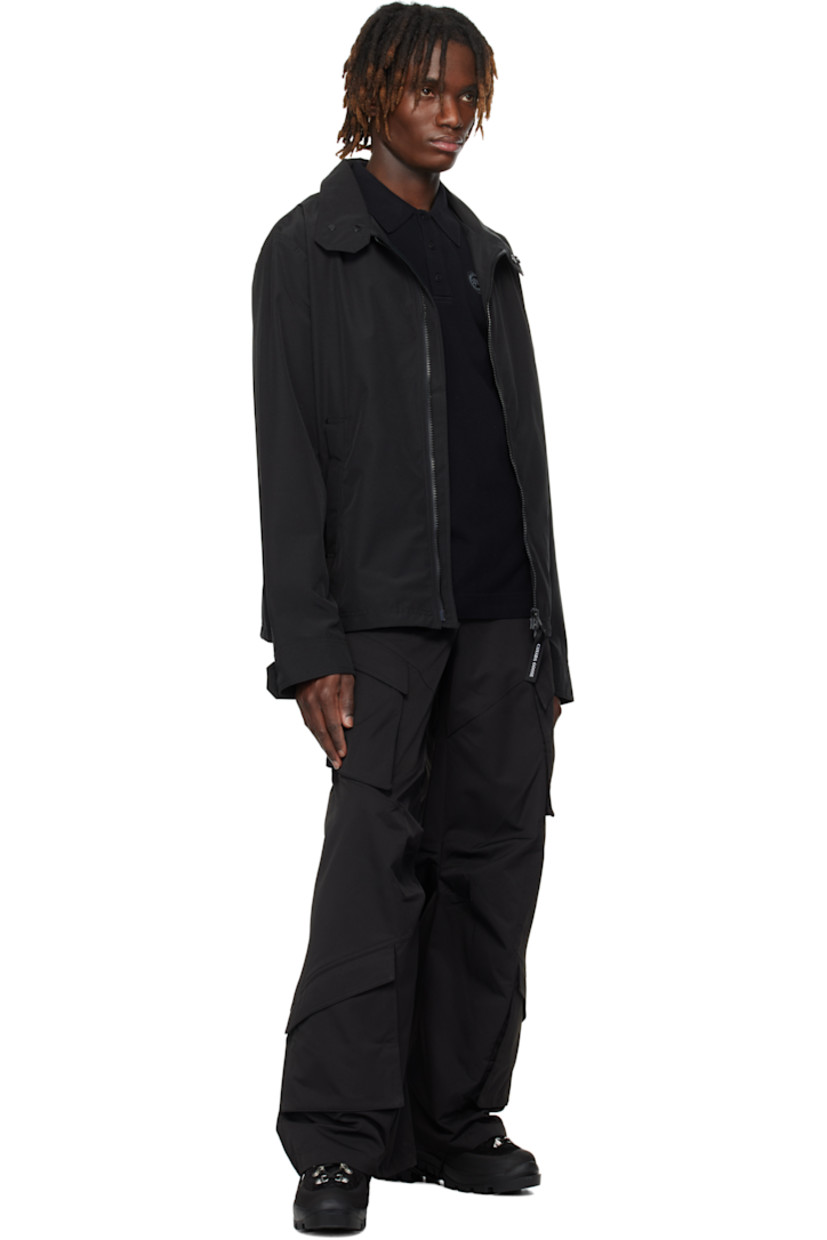 Polyester- and cotton-blend Arctic Tech® duck canvas jacket. Water-repellent.

· Press-stud fastening at stand collar
· Two-way zip closure
· Zip pockets
· Embroidered logo patch at sleeve
· Adjustable press-stud tab at cuffs
· Reflective trim at back collar
· Zip pocket at interior
· Full satin lining

Supplier color: Black