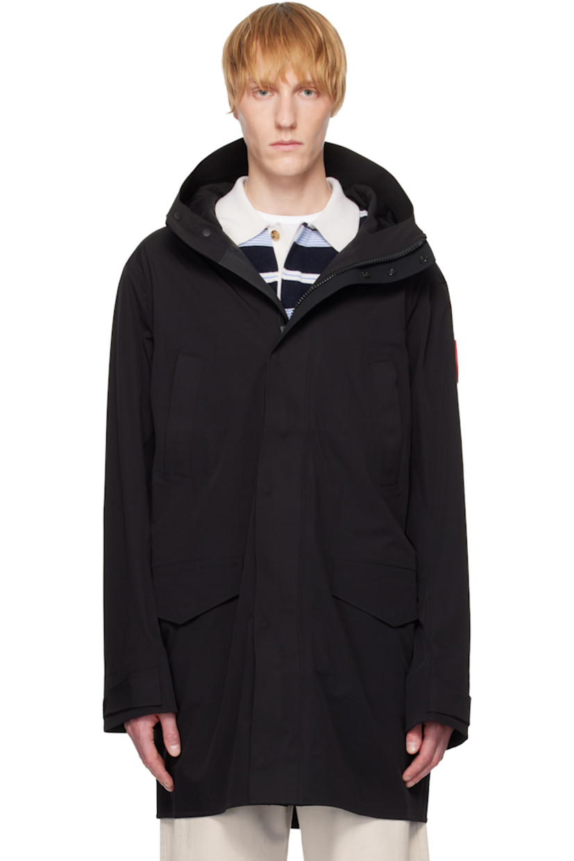 Waterproof stretch recycled nylon taffeta rain coat.

· Bungee-style drawstring at hood
· Stand collar
· Two-way zip closure with press-stud placket
· Zip and flap pockets
· Rubberized logo patch at sleeve
· Velcro tab at cuffs
· Storm flap at back
· Taped seams and zip pocket at interior
· Full bonded jersey and mesh lining

Supplier color: Black
