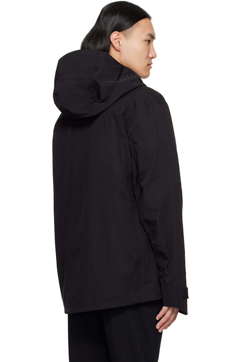 Stretch nylon taffeta jacket. Wind- and water-resistant.

· Bungee-style drawstring at hood and hem
· Two-way zip closure with press-stud placket
· Zip pockets
· Logo patch and zip pocket at sleeves
· Velcro tab at cuffs
· Zip pockets at interior
· Full satin lining

Supplier color: Black