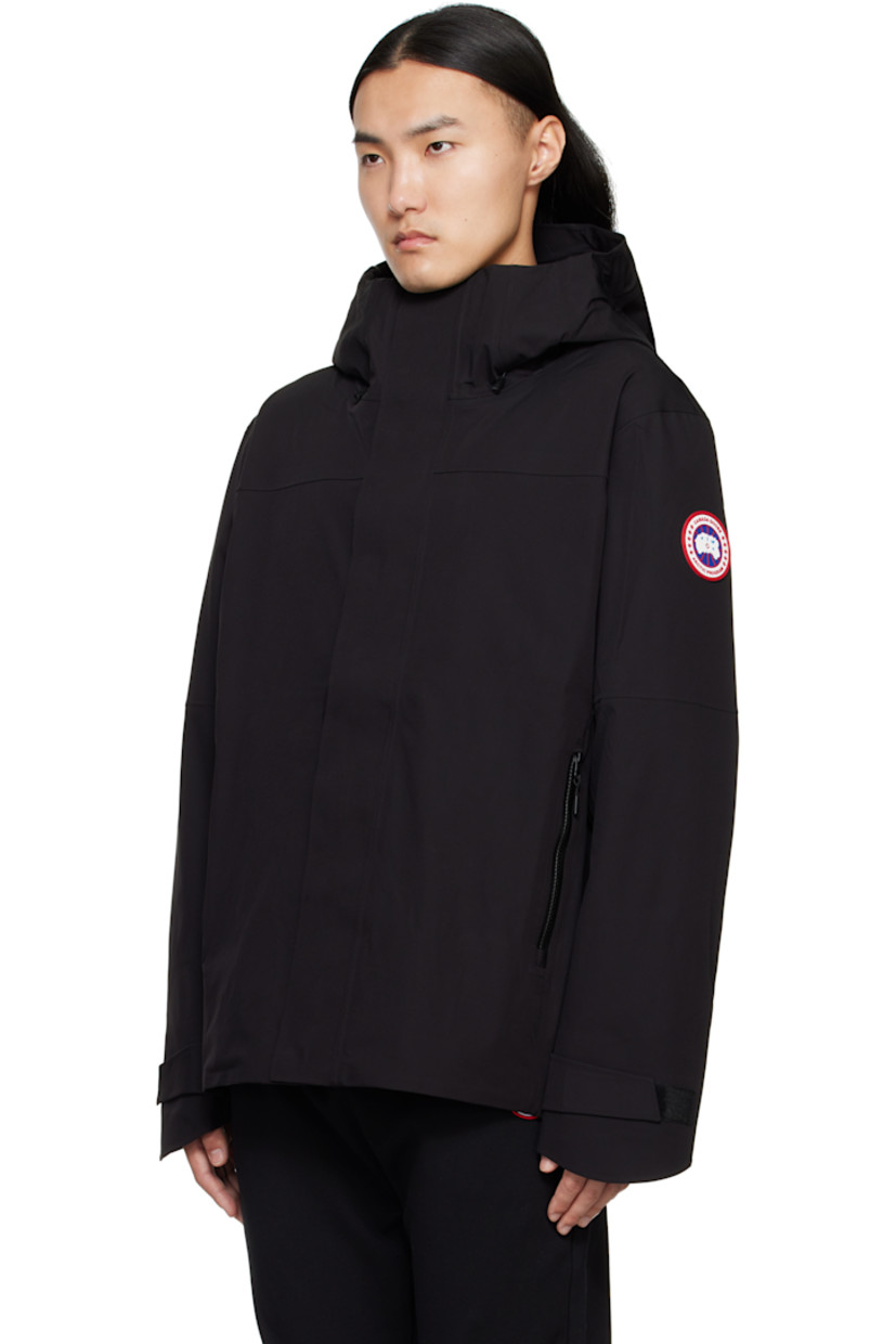 Stretch nylon taffeta jacket. Wind- and water-resistant.

· Bungee-style drawstring at hood and hem
· Two-way zip closure with press-stud placket
· Zip pockets
· Logo patch and zip pocket at sleeves
· Velcro tab at cuffs
· Zip pockets at interior
· Full satin lining

Supplier color: Black