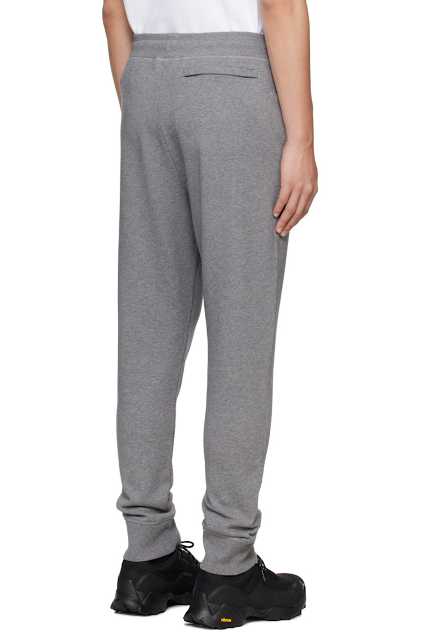 French terry sweatpants.

· Drawstring at elasticized waistband
· Rib-knit waistband and cuffs
· Three-pocket styling
· Embroidered logo patch at front

Part of the Black Label collection.

Supplier color: Stone heather