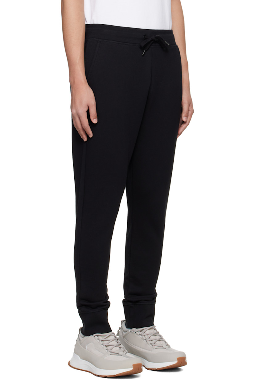 French terry sweatpants.

· Drawstring at elasticized waistband
· Rib-knit waistband and cuffs
· Three-pocket styling
· Embroidered logo patch at front

Supplier color: Black