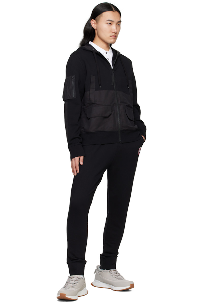French terry sweatpants.

· Drawstring at elasticized waistband
· Rib-knit waistband and cuffs
· Three-pocket styling
· Embroidered logo patch at front

Supplier color: Black