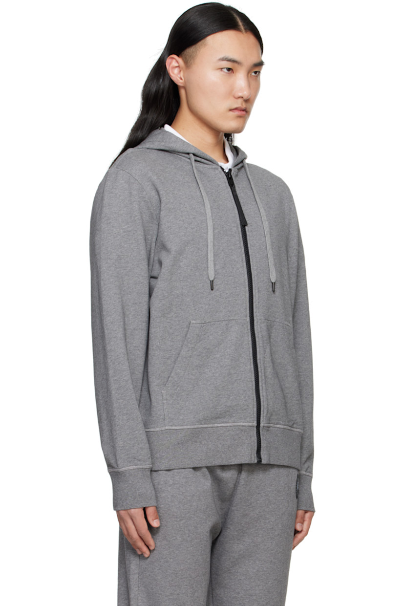 Cotton French terry hoodie.

· Drawstring at hood
· Zip closure
· Patch pockets
· Rib-knit hem and cuffs
· Embroidered logo patch at sleeve

Part of the Black Label collection.

Supplier color: Stone Heather