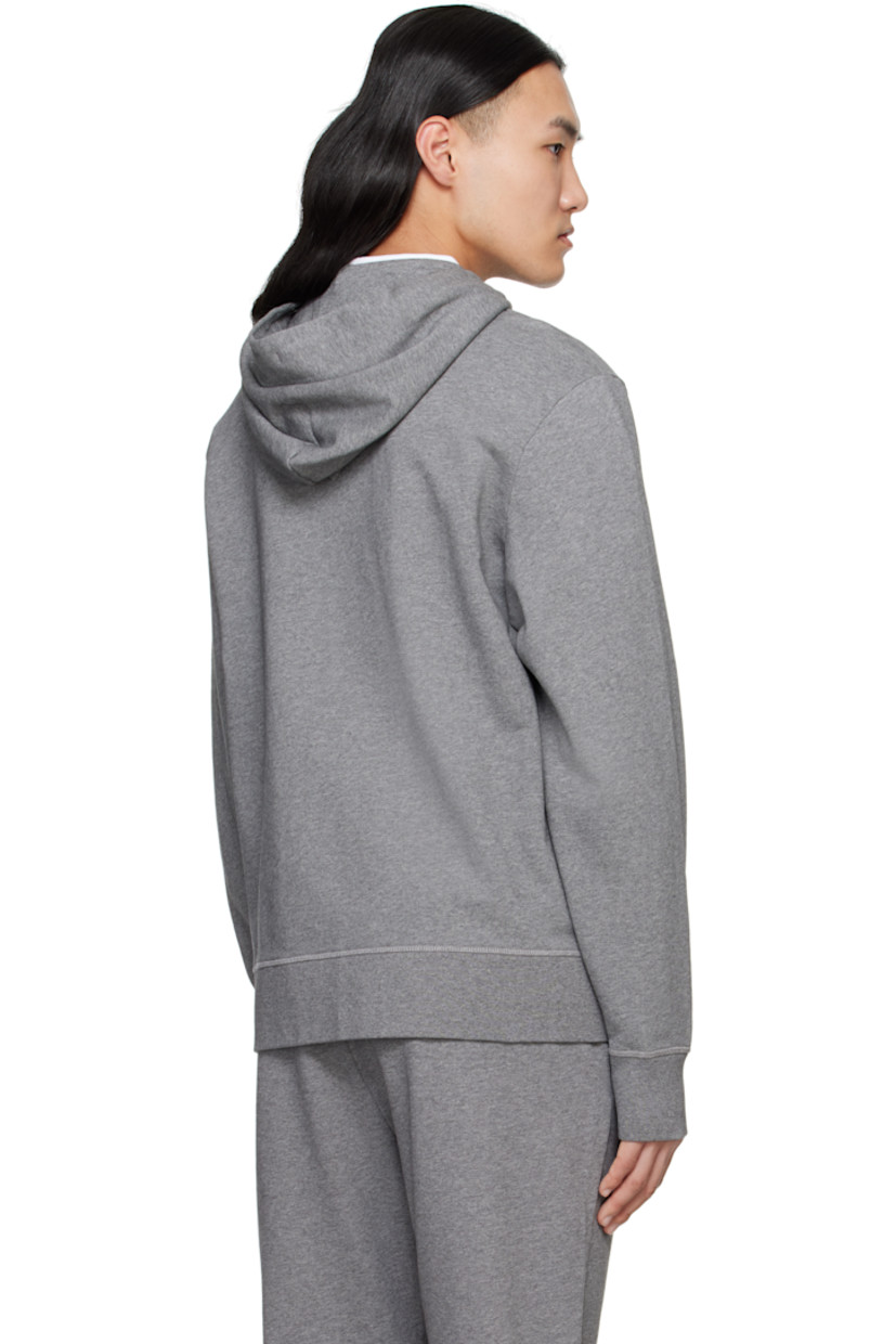 Cotton French terry hoodie.

· Drawstring at hood
· Zip closure
· Patch pockets
· Rib-knit hem and cuffs
· Embroidered logo patch at sleeve

Part of the Black Label collection.

Supplier color: Stone Heather