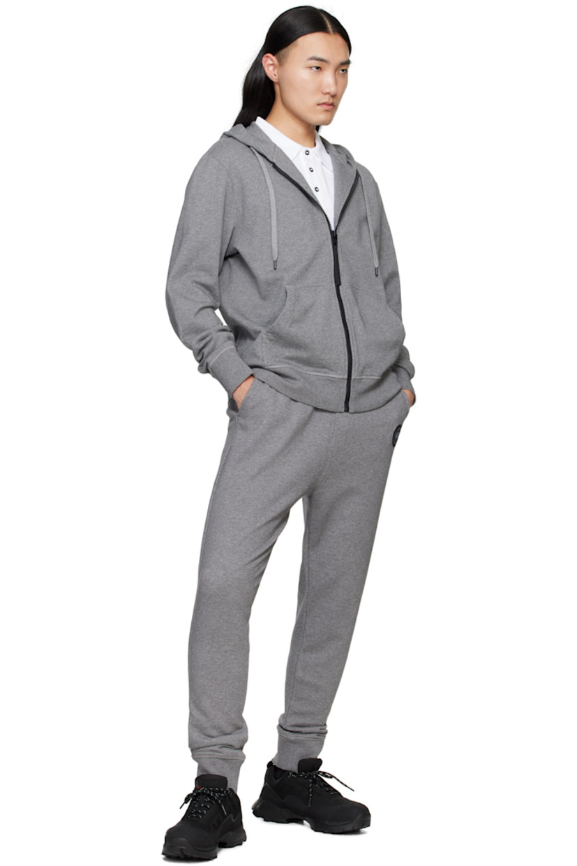 Cotton French terry hoodie.

· Drawstring at hood
· Zip closure
· Patch pockets
· Rib-knit hem and cuffs
· Embroidered logo patch at sleeve

Part of the Black Label collection.

Supplier color: Stone Heather