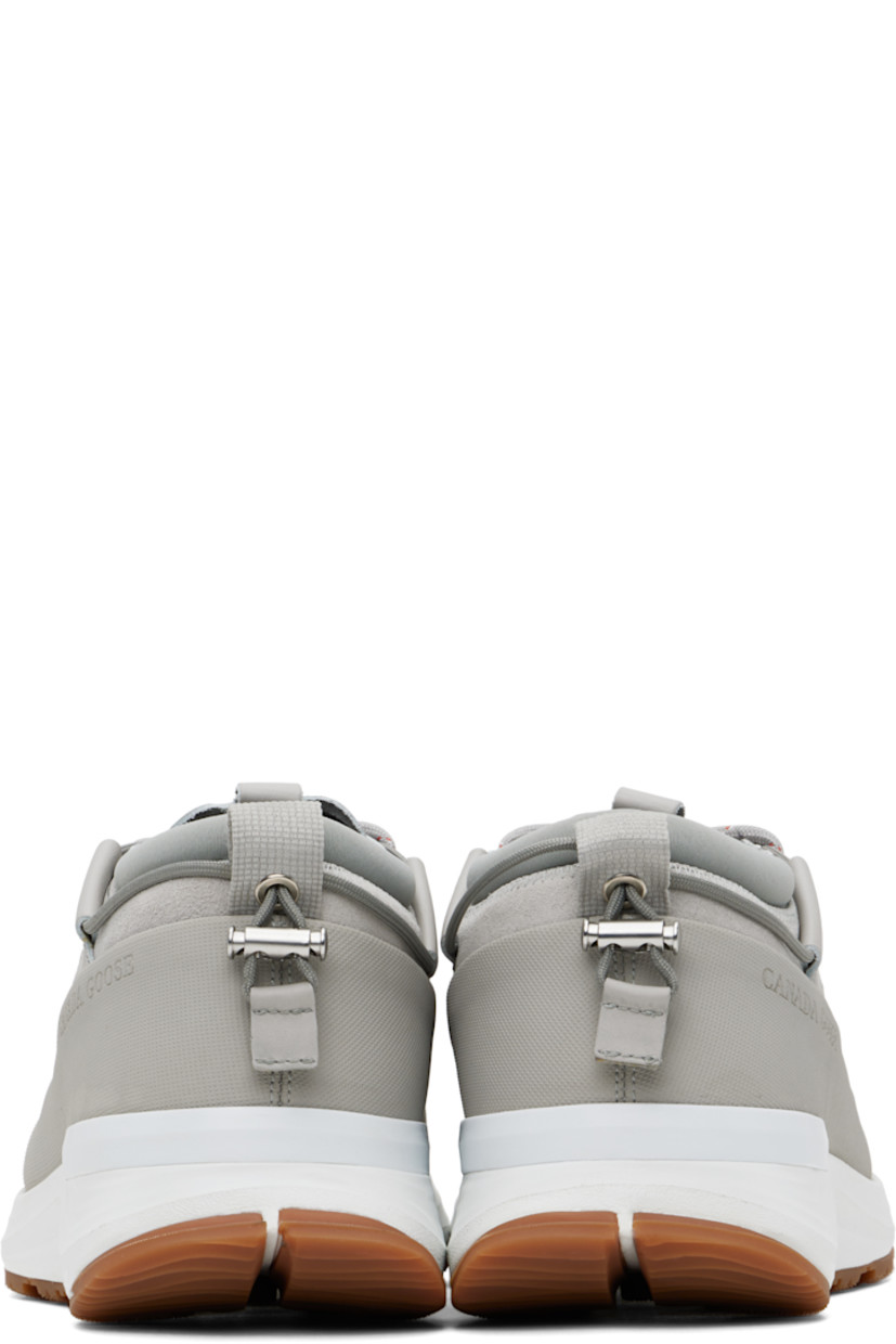Low-top buffed leather and nubuck sneakers in gray.

· Waterproof
· Lace-up closure 
· Cord-lock ankle drawstring
· Logo patch at tongue
· Padded sock-style collar
· Logo embossed at outer side
· Perforated detailing 
· Pull-loop at heel collar 
· HDry® jersey lining
· Microfibre onSteam® footbed
· Rubberized trim at welt 
· Heel stabilizer at foam rubber midsole
· Treaded rubber sole

Supplier color: Limestone/White