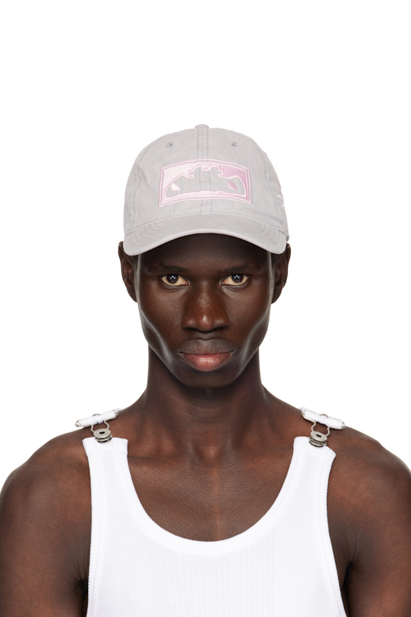 Cotton canvas cap in gray.

· Embroidered eyelets at crown
· Embroidered logo at face, side, and back
· Curved brim
· Cinch strap at back
· Twill browband
· Unlined

Supplier color: Grey/Pink