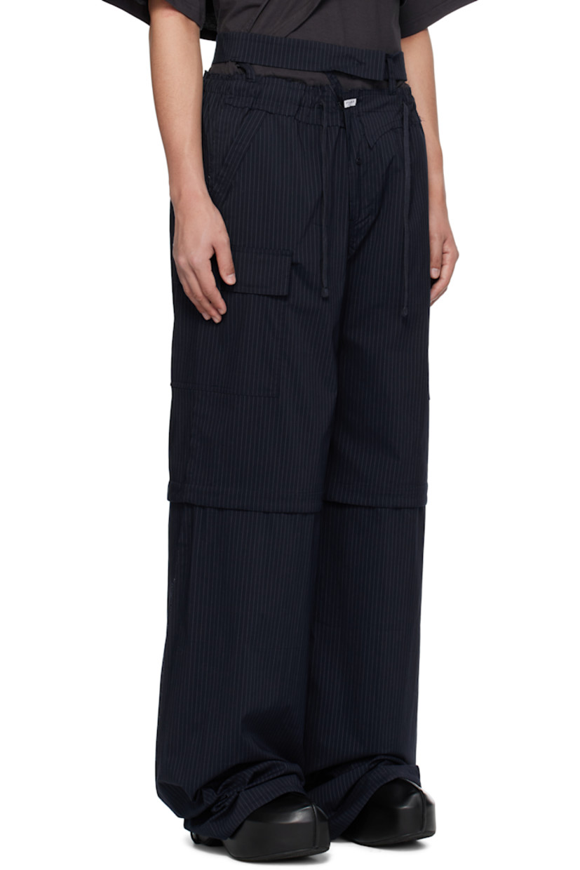 Stretch cotton-blend poplin cargo pants. Stripes and raw edges throughout.

· Drawstring at elasticized waistband
· Trim with button fastening at waistband
· Four-pocket styling
· Offset zip fly
· Logo patch at front
· Drawstring at knees and cuffs
· Cargo pocket at outseams
· Logo flag at back

Supplier color: Striped
