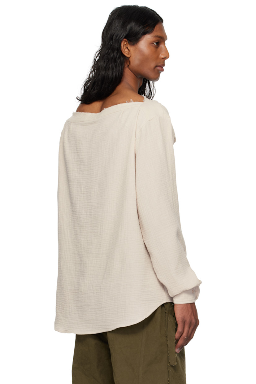 Cotton muslin shirt. 

· Raw edge at boat neck 
· Extended trim at spread collar 
· Button closure
· Logo embroidered at patch pocket
· Shirttail hem
· Dropped shoulders
· Buttoned barrel cuffs
· Twin pleats at back yoke

Supplier color: Stone
