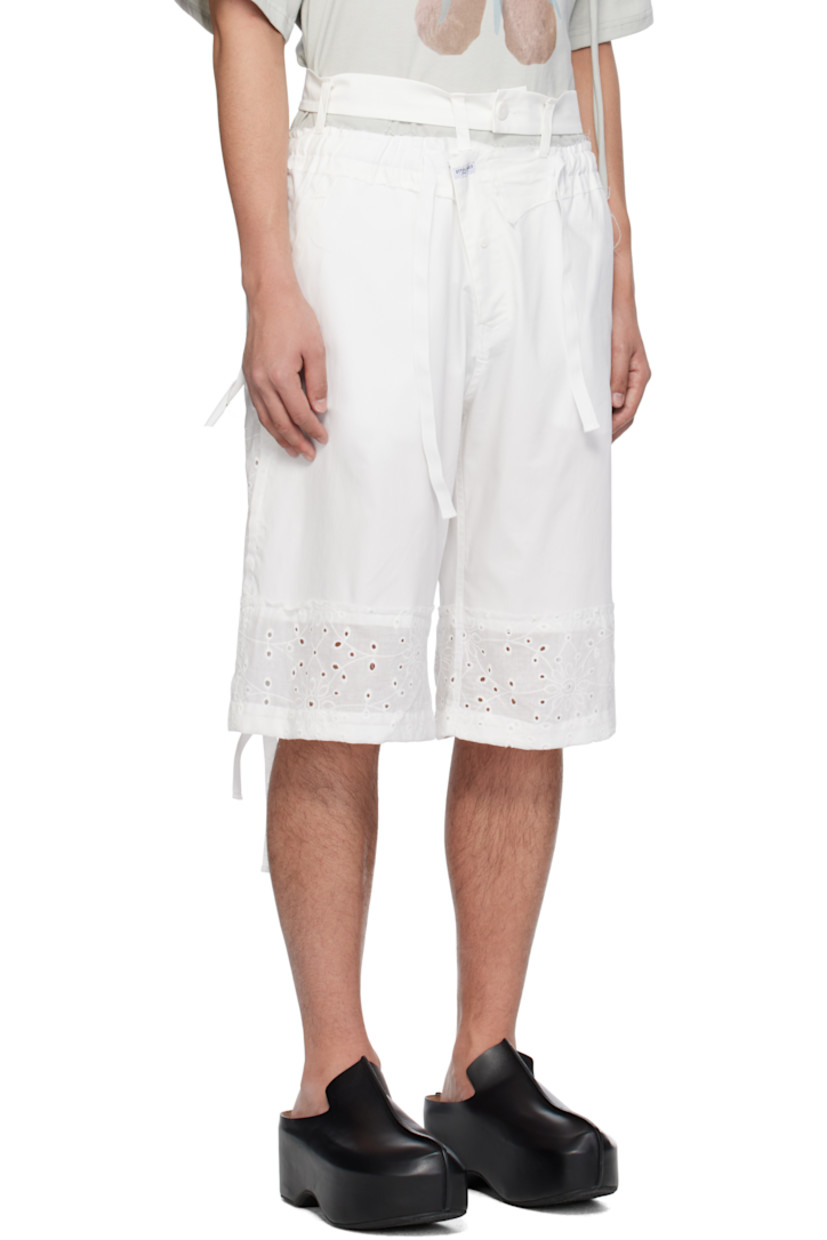 Stretch polyester-blend twill and broderie anglaise shorts. Raw edges and embroidered floral pattern throughout.

· Paneled construction
· Drawstring at elasticized waistband
· Trim with button fastening at waistband
· Four-pocket styling
· Offset zip fly
· Logo patch at front
· Drawstring at cuffs
· Logo flag at back pocket

Supplier color: White