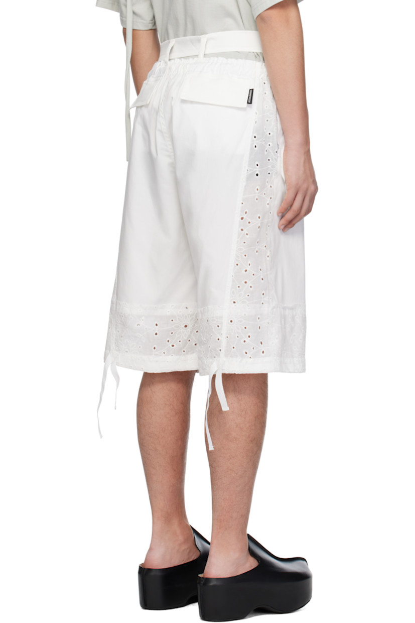 Stretch polyester-blend twill and broderie anglaise shorts. Raw edges and embroidered floral pattern throughout.

· Paneled construction
· Drawstring at elasticized waistband
· Trim with button fastening at waistband
· Four-pocket styling
· Offset zip fly
· Logo patch at front
· Drawstring at cuffs
· Logo flag at back pocket

Supplier color: White