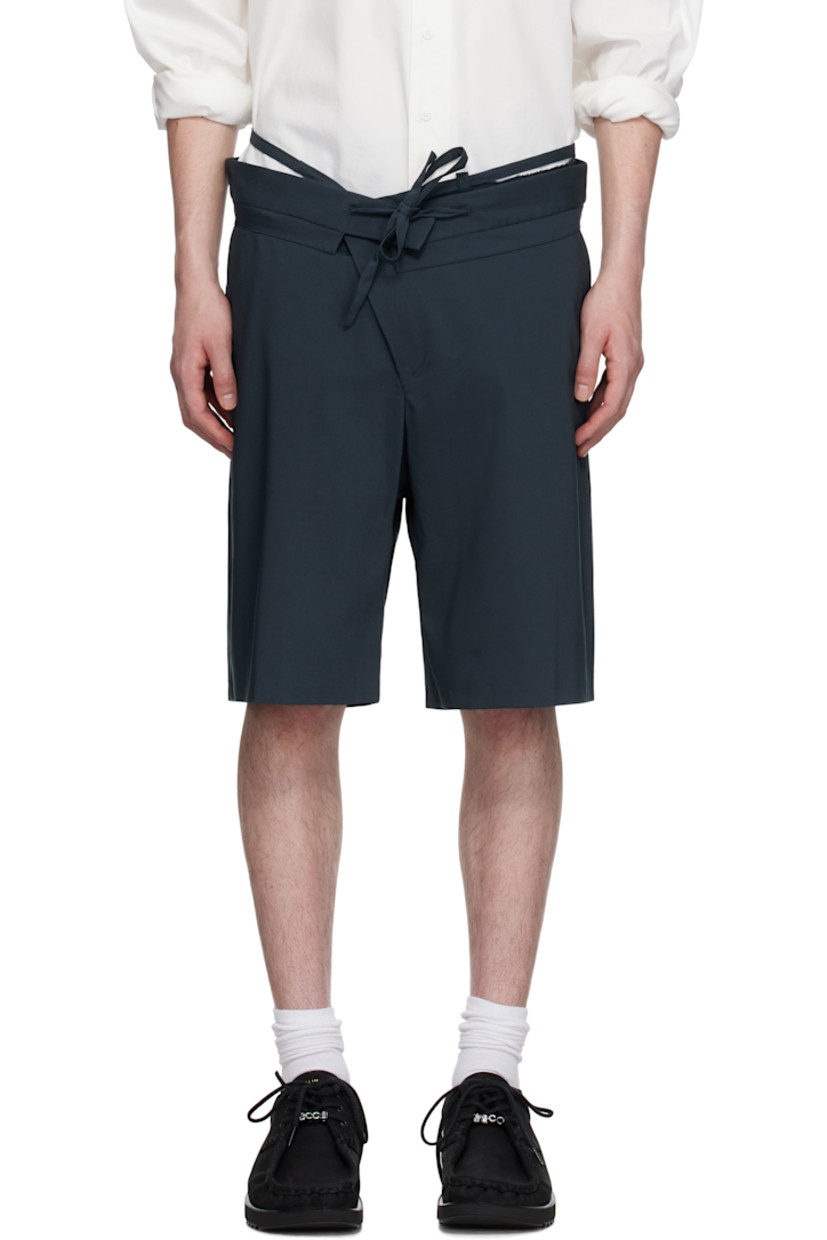 Plain-woven stretch cotton-blend shorts.

�· Belt-style strap and raw edges at layered waistband
· Drawstring at foldover waistband
· Three-pocket styling
· Offset zip fly

Supplier color: Dark blue