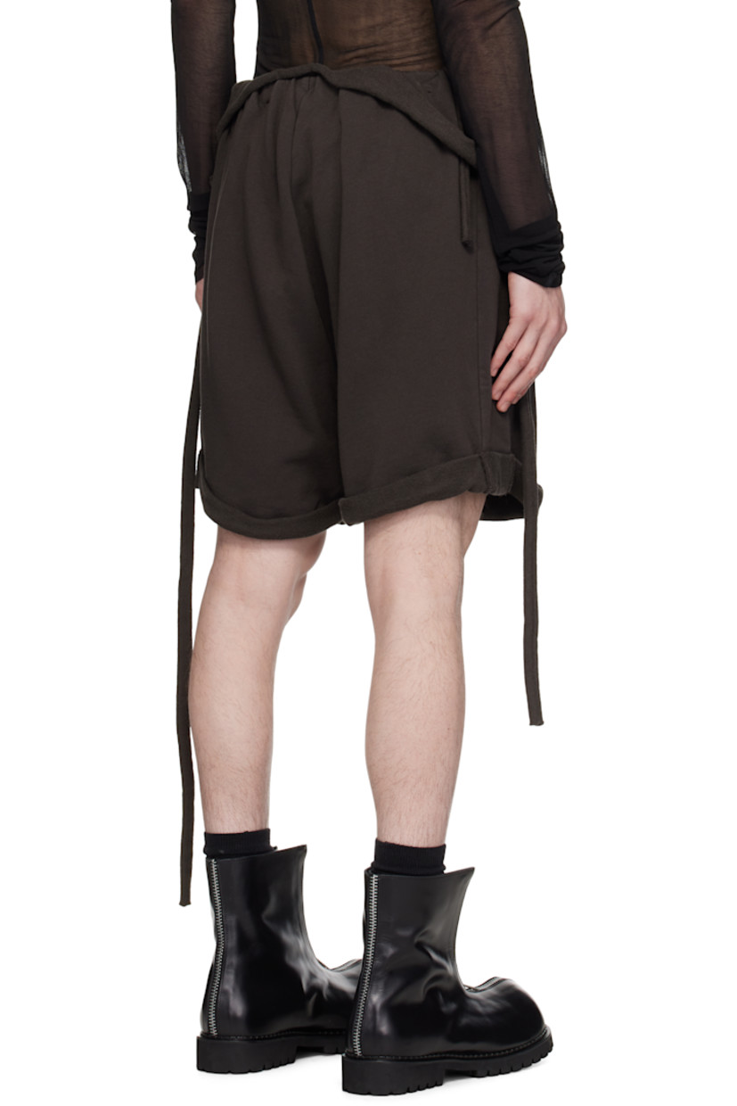 Handcrafted organic cotton French terry shorts. Rolled raw edges throughout.

· Wrap construction
· Self-tie fastenings at elasticized waistband
· Two-pocket styling

Supplier color: Dark brown